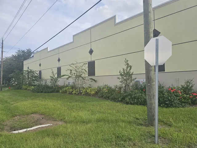 Landscaped exterior wall of the garage condo building