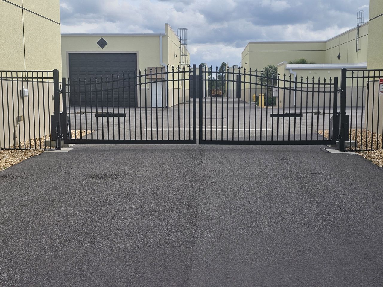 Black steel entry gate at the Punta Gorda garage condo property